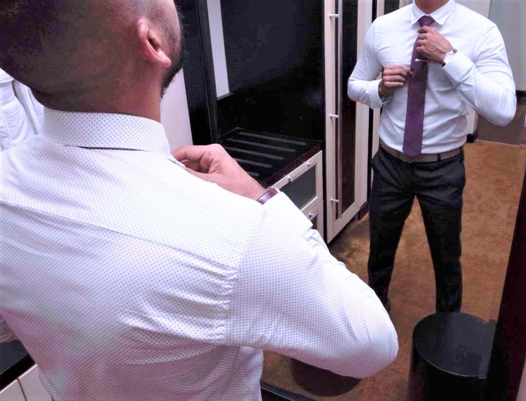 Men in business formal dress in a meeting