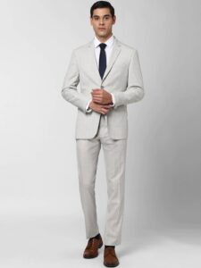 Man in business formal wearing light grey suit